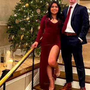 A long red dress with a semi deep V neck line